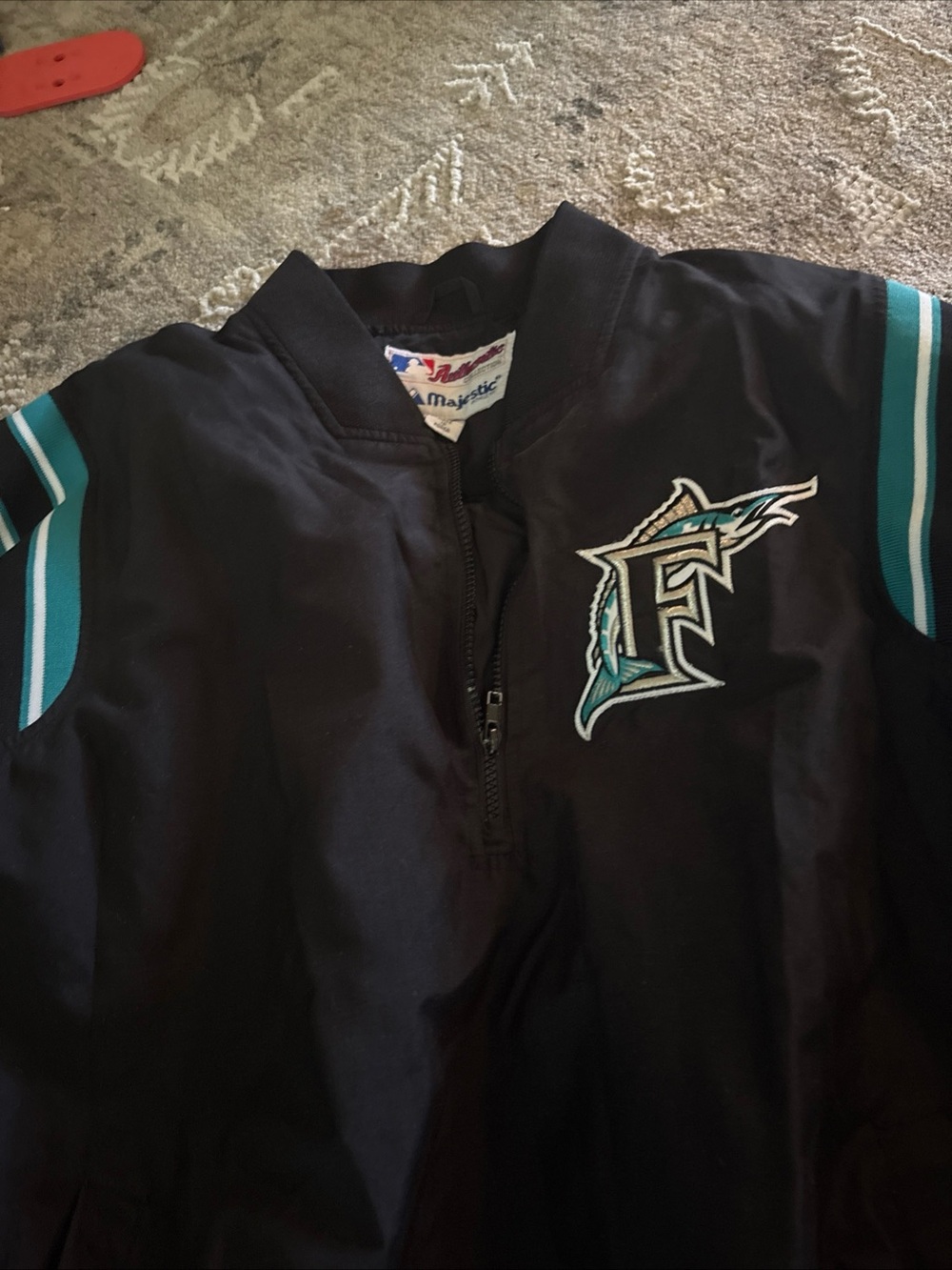 Majestic Black Jacket with Teal Stripe and Team Emblem